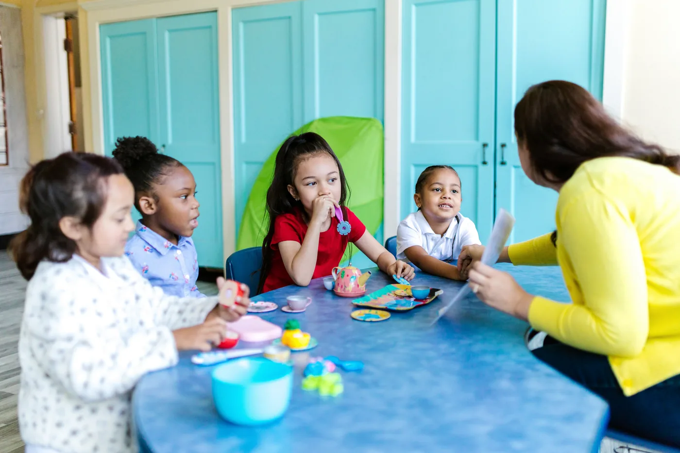 Young children participating in a guided classroom activity
